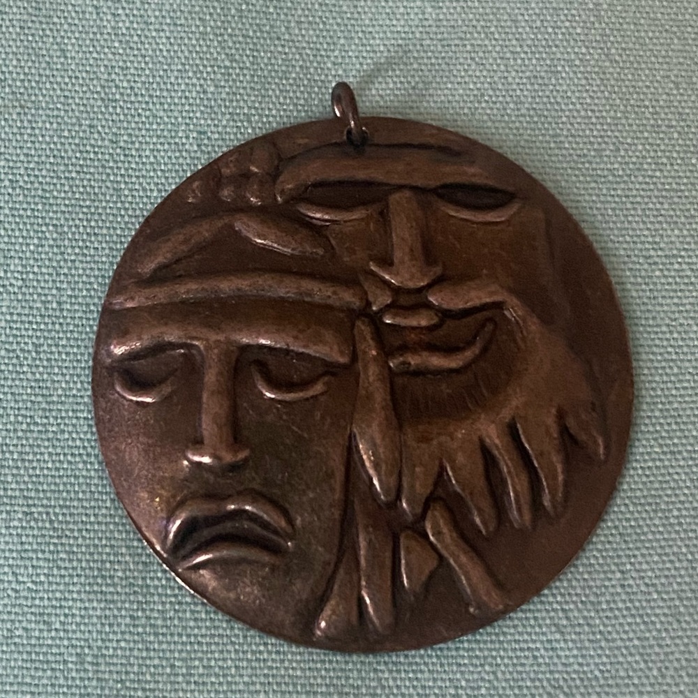 Vintage Metal Embossed Face Pendant